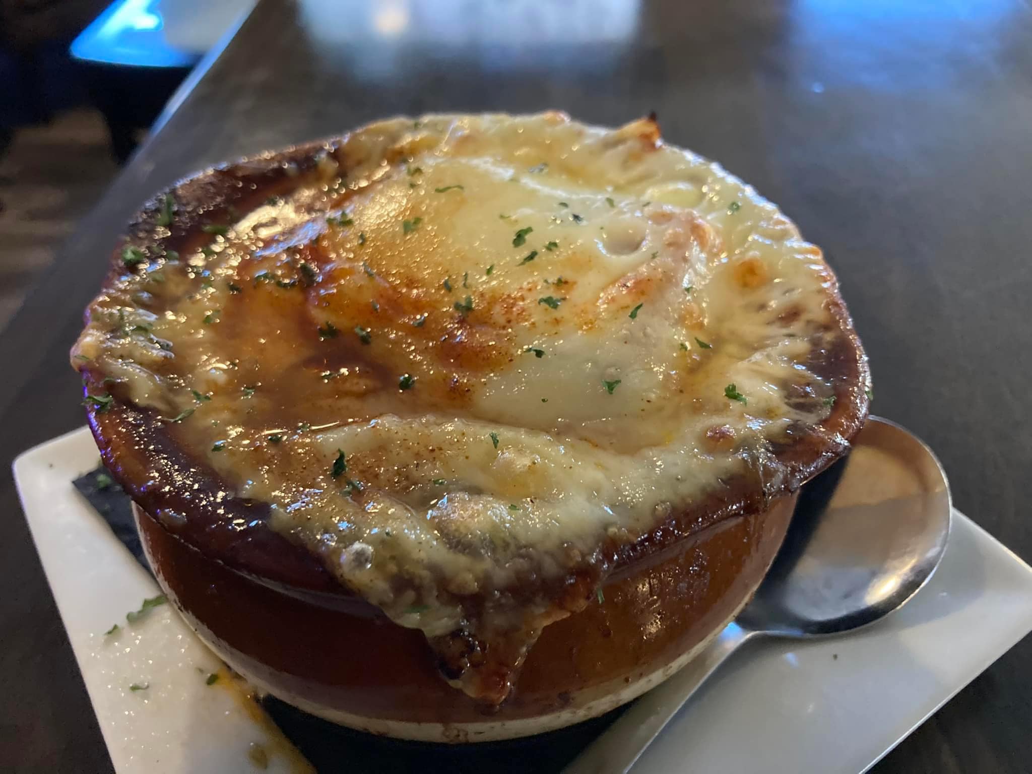 The French onion soup, an occasional special at Tavern on the Line, is a cheesy delicacy.